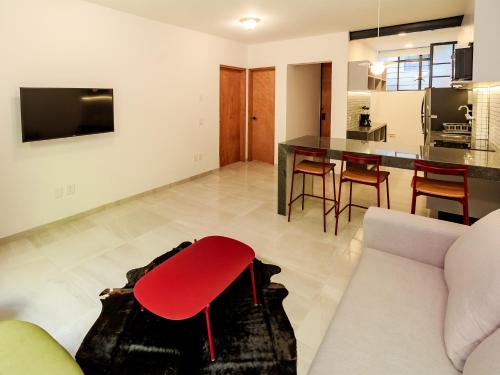 a living room with a couch and a table at Roma 1888 in Guadalajara