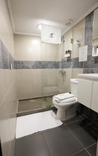 a bathroom with a toilet and a sink at SunnySide Apartment - Lovely and Cozy Studio in Byblos in Jbeil