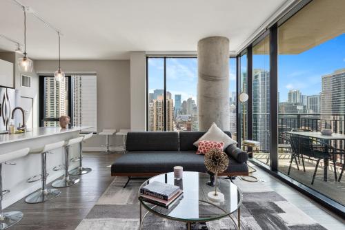 a living room with a couch and a table at Aurelien Spacious Apartments in the Heart of Gold Coast in Chicago