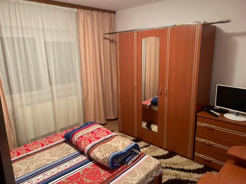 Ένα ή περισσότερα κρεβάτια σε δωμάτιο στο Apartament
