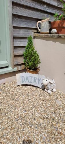 a teddy bear and a sign that says diary at The Dairy at Wyke Farm in Axminster