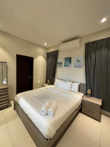 Postel nebo postele na pokoji v ubytování Hawana Salalah Resort - Acacia 5