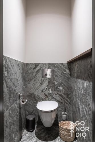 a bathroom with a toilet and a sink at The Reindeer Lodge including guesthouse in Tällberg