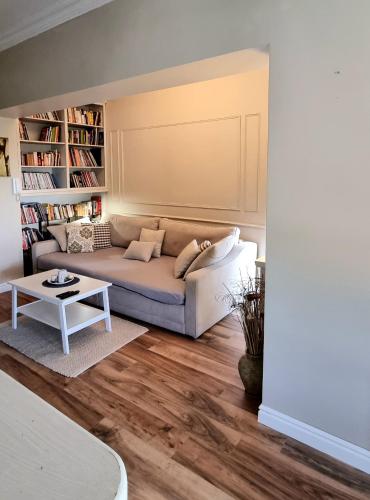 a living room with a couch and a table at Beach apartment Suzy&Demi in Split