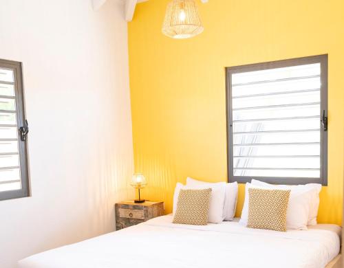 Postel nebo postele na pokoji v ubytování Kura Kabana by Boutique Bonaire Unique Resorts