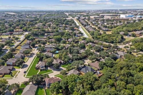 an aerial view of a residential neighborhood with houses at The staycation, 4 beds-3 baths, with pool and hot tub near AT&T stadium, 20 mins to Dallas and Fort Worth in Grand Prairie