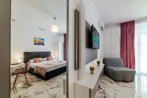 En eller flere senge i et værelse på Lexxa 4 Casa Del Mar -Mamaia Nord