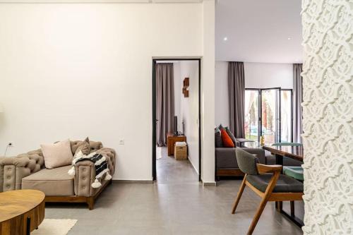 a living room with a couch and a table at Villa michlo in El Makina