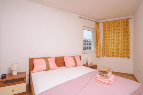 Postel nebo postele na pokoji v ubytování Apartment Eli