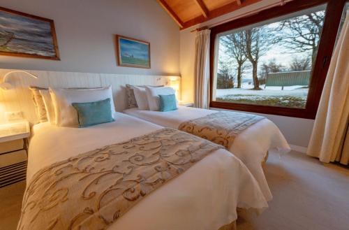Tolkeyen Ushuaia Hotelにあるベッド