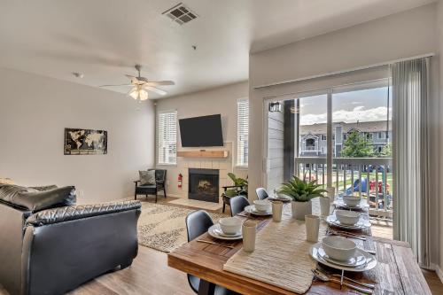a living room with a table and a couch at Mountain View by Cloud Dream Homes in Clearfield