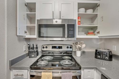 a kitchen with a stove and a microwave at Mountain View by Cloud Dream Homes in Clearfield