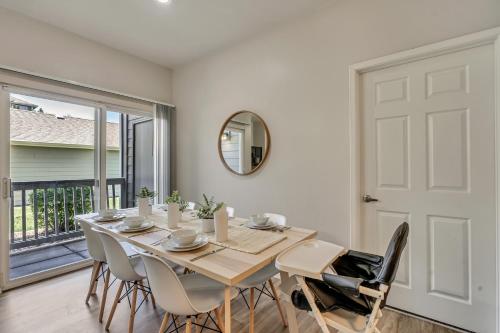 a dining room with a table and chairs and a mirror at Mountain View by Cloud Dream Homes in Clearfield