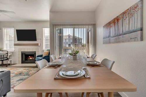 a dining room with a table and a living room at Mountain View by Cloud Dream Homes in Clearfield