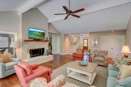 a living room filled with furniture and a fireplace at Fairway Oasis in Hilton Head Island