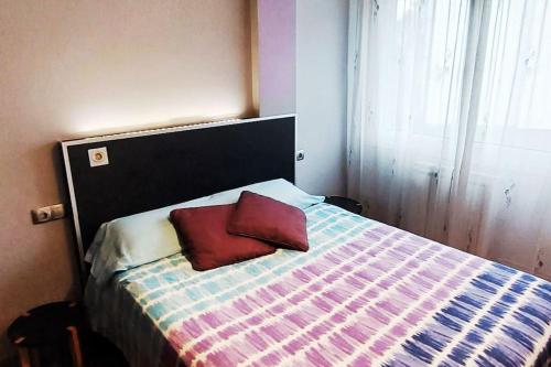 Giường trong phòng chung tại Apartamento con 2 habitaciones