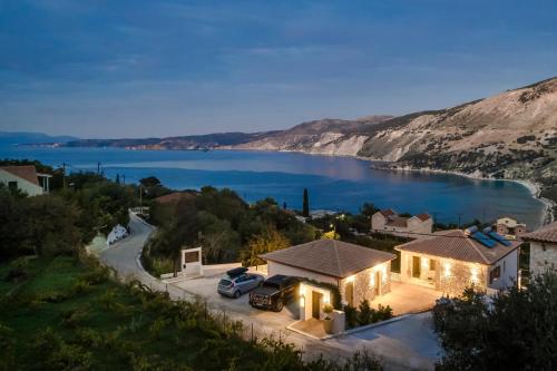 a house with a view of a lake at aZOLAki Suites in Zóla