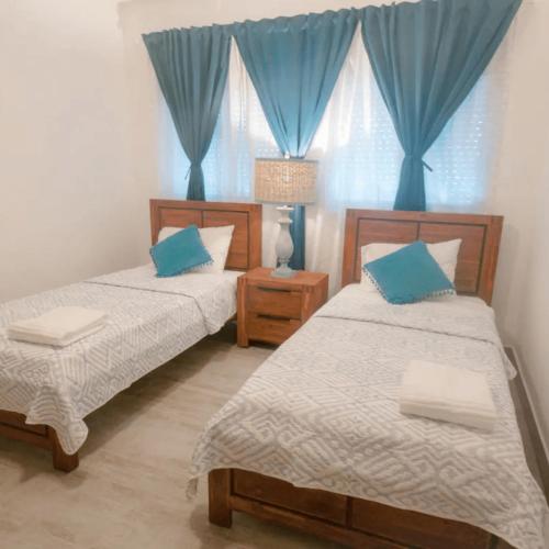 Ένα ή περισσότερα κρεβάτια σε δωμάτιο στο Beachfront condo on Los Corales Beach, Playa Bavaro