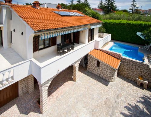 an aerial view of a house with a swimming pool at Villa Kovach in Krk