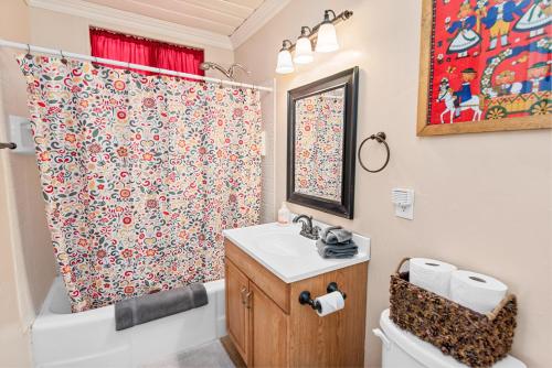 a bathroom with a sink and a shower curtain at Norske Nooke - Experience the best of Big Bear Walk to Bear Mountain and the Golf Course in Big Bear Lake