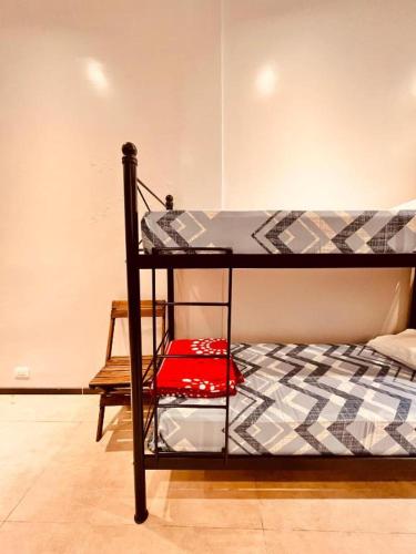 Ένα ή περισσότερα κρεβάτια σε δωμάτιο στο Sumaq Hostel Backpackers