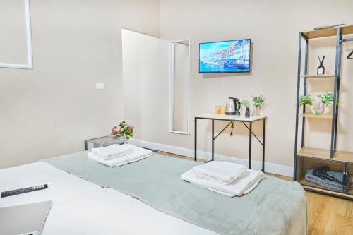 TV a/nebo společenská místnost v ubytování Cattaleya rooms