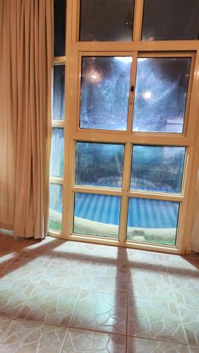 an empty room with a large window with a view at استراحة شاطئ ابحر الجنوبيه south obhur beatch chalet in Jeddah