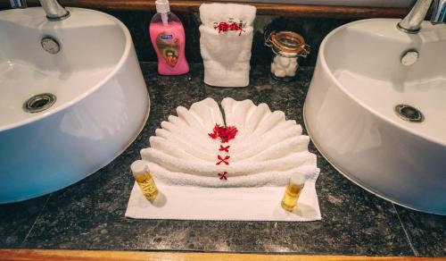 a bathroom counter with a towel and a sink at Brahma Blue Resort in San Pedro