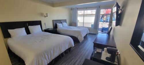 Ένα ή περισσότερα κρεβάτια σε δωμάτιο στο North Shore Wayside Inn