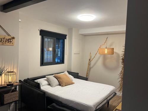 En eller flere senge i et værelse på El refugio del mar