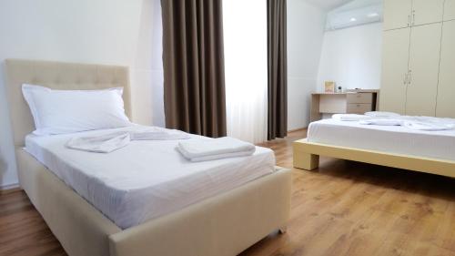 Postel nebo postele na pokoji v ubytování Tirana view spacious apartment 07