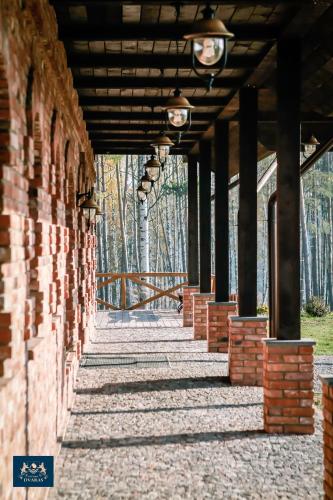 a brick wall with lights on top of it at Dzūkijos dvaras in Alytus