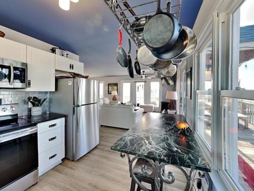 a kitchen with a counter top in a room at Sea Chase in Topsail Beach