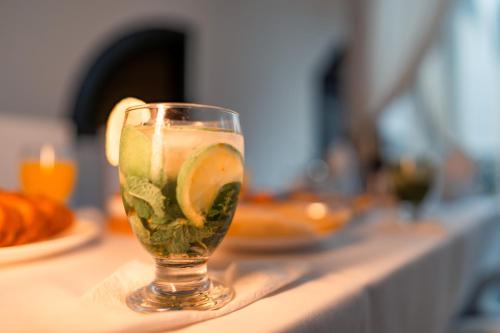 a drink in a glass sitting on a counter at Riad L'ECOLE in Marrakech