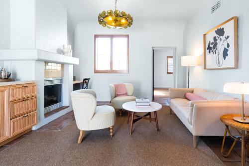 a living room with a couch and a table at Palihouse Santa Barbara in Santa Barbara