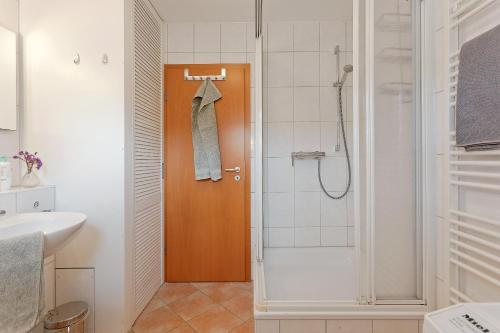 a bathroom with a shower and a sink at Haus 113, Birkenweg 6 a in Ostseebad Karlshagen
