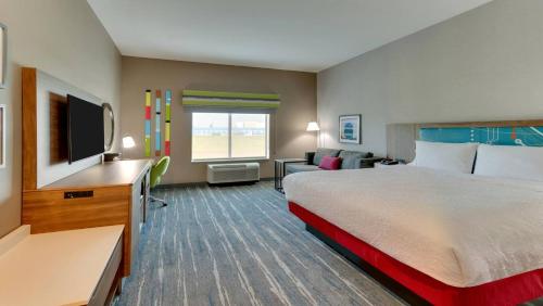 a hotel room with a bed and a television at Hampton Inn Lebanon, IN in Lebanon