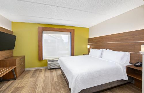 a hotel room with a bed and a window at Holiday Inn Express & Suites Kings Mountain - Shelby Area by IHG in Kings Mountain