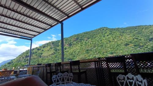 a restaurant with a view of a mountain at Royal Palace Hostal in Panajachel