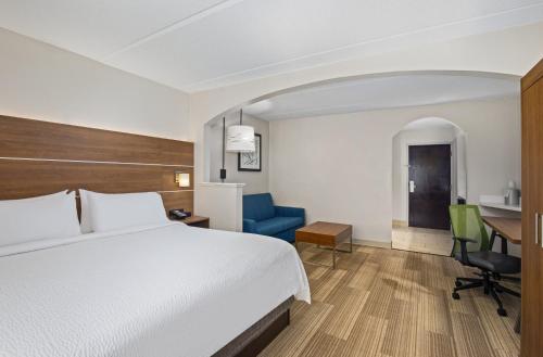 a hotel room with a bed and a desk at Holiday Inn Express & Suites Kings Mountain - Shelby Area by IHG in Kings Mountain