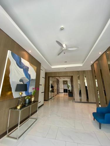 a lobby of a hotel with a ceiling fan at MG Place -2 BR condo unit at SMDC Charm Residences, Cainta, Rizal, 1900 in Cainta