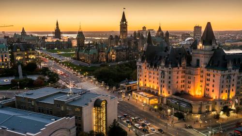 an aerial view of a city at sunset at Holiday Inn - Ottawa Dwtn - Parliament Hill by IHG in Ottawa