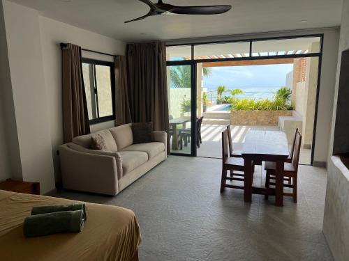 a living room with a couch and a table at Corazon De Baler in Baler