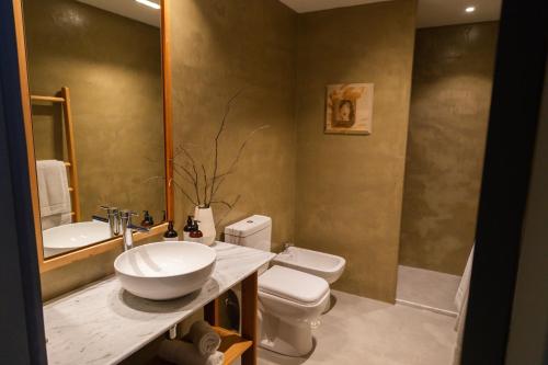 a bathroom with a sink and a toilet at Casa Lahusen in Colonia del Sacramento