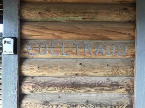 a wooden door with the wordnatural written on it at Edeltraud in Kalkite