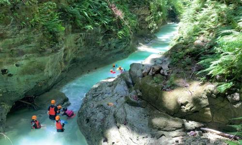 a group of people rafting down a river at Tipolo Guesthouse in Basdiot