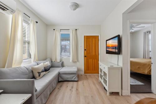 a living room with a couch and a television at 108 W 20Th Ave, Unit 2 in North Wildwood