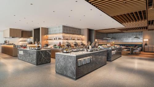 a large kitchen with a bunch of counters at Crowne Plaza Penang Straits City by IHG in Perai