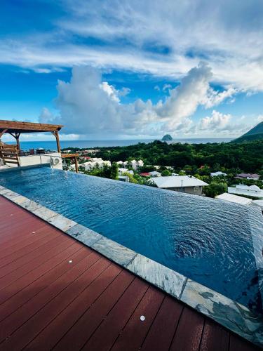 a swimming pool on the roof of a house at Villa SKY 4 Chambres - Vue sur le Diamant in Morne Blanc