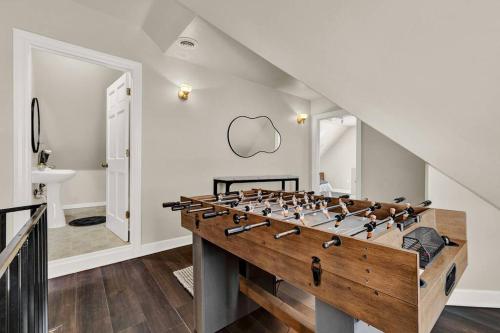 a large game room with a large foos ball at NEW! Fun & style Eastside MKE Best Day Townhouse in Milwaukee